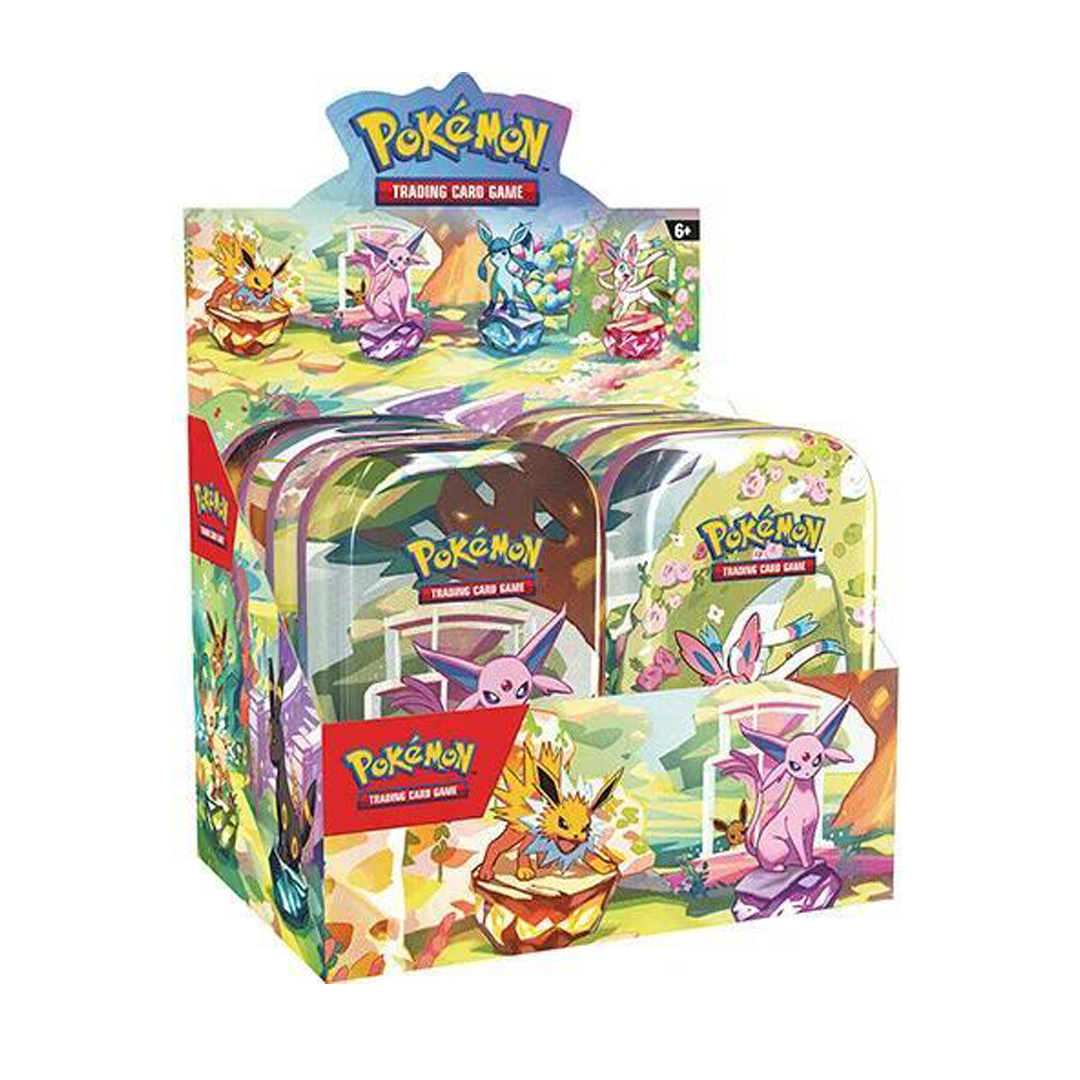 Small metal tin display with colorful prismatic trading card booster packs neatly arranged for collectors